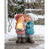 Kép 2/2 - Figura MagicHome, karácsonyi, fiú és lány hógömbbel, 1 LED, kerámia, 27,5x23x40 cm