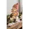 Kép 2/2 - Figura MagicHome Karácsonyi, Kislány sámlin ülve sündisznóval, 1 LED, polirezin, 10,5x10,5x19,5 cm