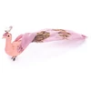 Kép 1/3 - Madár MagicHome Karácsony, rózsaszín páva csipesszel, 23 cm