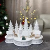 Kép 2/2 - Dekoráció MagicHome Karácsony, falu szarvasokkal, 10 LED meleg fehér, 2xAA, MDF, 30x14x19,5 cm